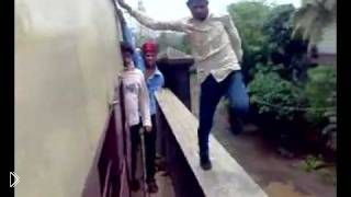 Crazy Indian guys doing dangerous stunts on a train